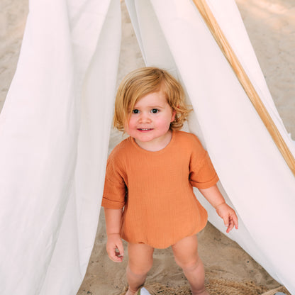 Riley Bubble Hem Organic Cotton Romper in Burnt Orange